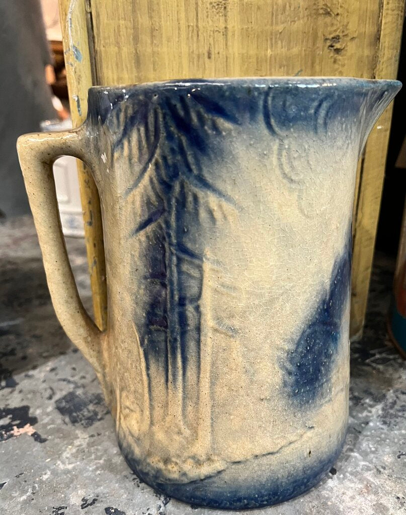 TAN WITH BLUE DEER/FORREST SCENE STONEWARE PITCHER